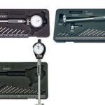 Fowler Dial Bore Gage Set with self-centering design, carbide-tipped anvils, and chrome-plated handle in fitted case